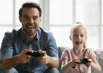 Dad playing game with daughter