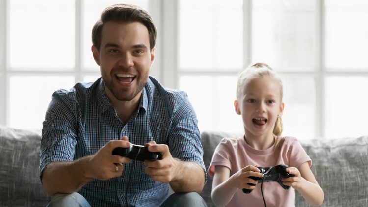 Dad playing game with daughter